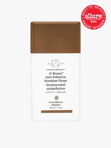 Drunk Elephant D-Bronzi Anti-Pollution Sunshine Drops white and brown branded component with accents on a light gray background with red Allure Best of Beauty seal in the top right corner